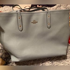 Light blue coach purse with matching wallet.